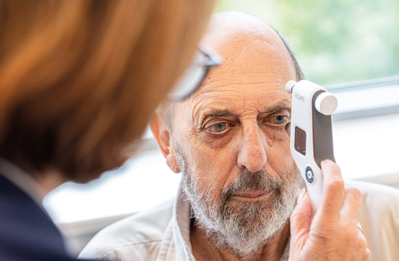 A SpaMedica nurse checking the eye fluid pressure of a SpaMedica patient using a Tonometer