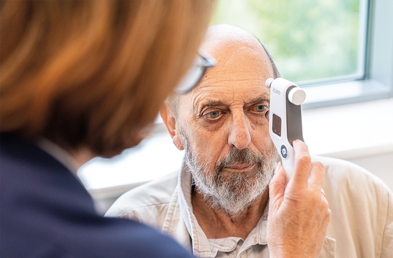 A SpaMedica nurse checking the eye fluid pressure of a SpaMedica patient using a Tonometer