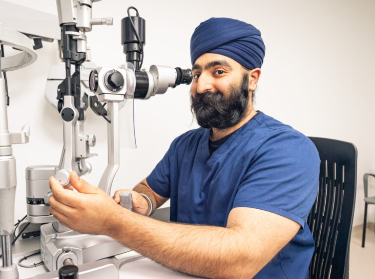 SpaMedica Optometrist happily checking optical equipment