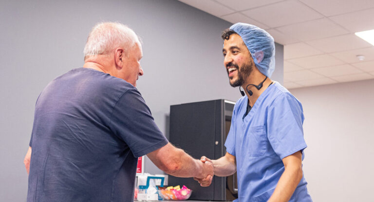 A SpaMedica consultant shaking hands with a SpaMedica patient after a successful cataract surgery