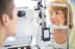 patient having eye tested by optometrist