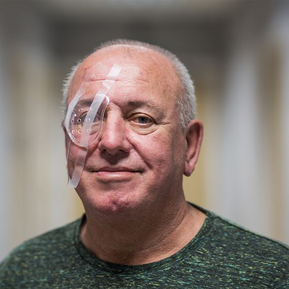 Happy SpaMedica patient wearing eye shield