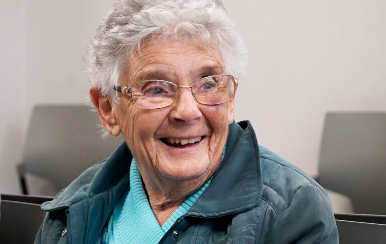 Delighted SpaMedica patient looking on in a reception area