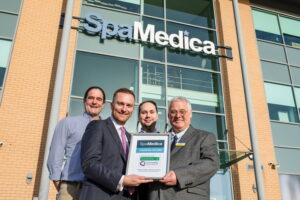 Stockton MP Matt Vickers handing outstanding CQC certificate to Stockton hospital manager with SpaMedica medical director and associate medical director in attendance