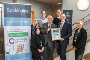 Stockton MP Matt Vickers handing outstanding CQC certificate to Stockton hospital manager with SpaMedica medical director and associate medical director and SpaMedica Team in attendance