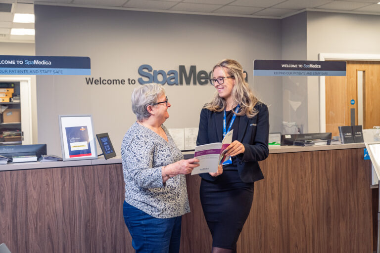 Woman holding guide book with consultant