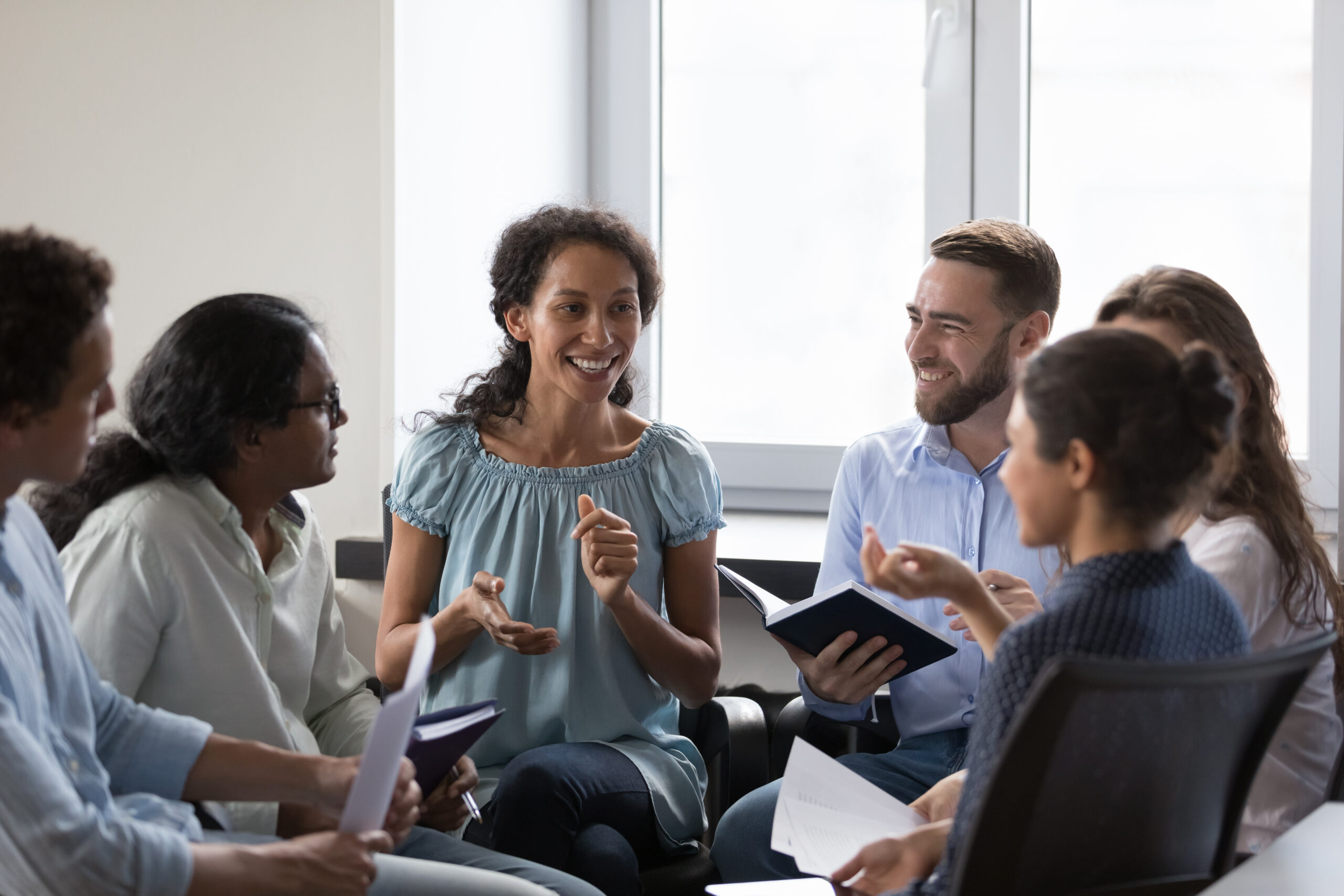 Multiethnic employees brainstorming on team training