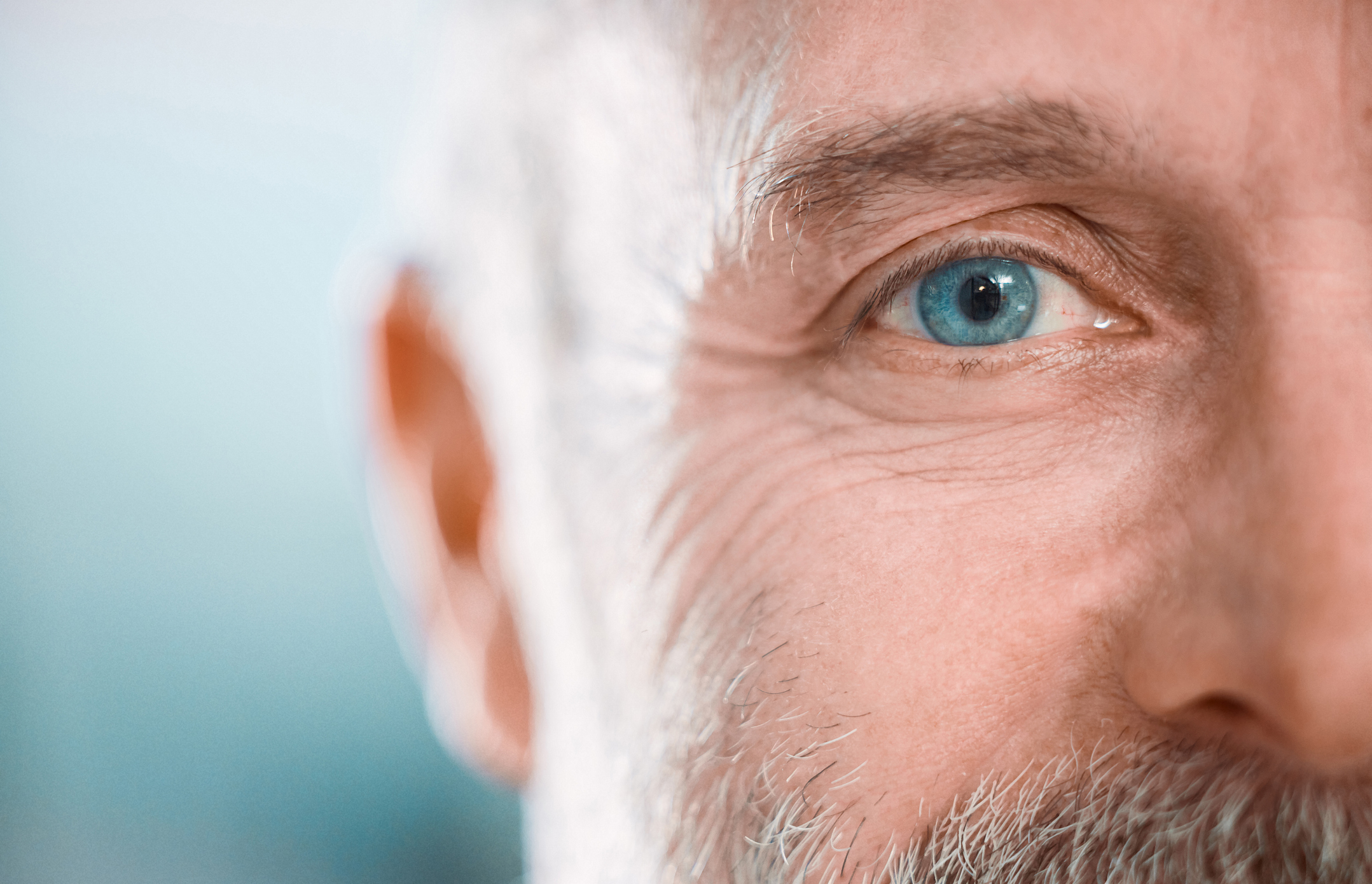 Cropped shot of an unrecognisable man looking into the camera during a day in the office